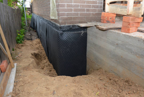 SJ Waterproofing Pros technician performing targeted Exterior Waterproofing assessment in Cloverdale, VA
